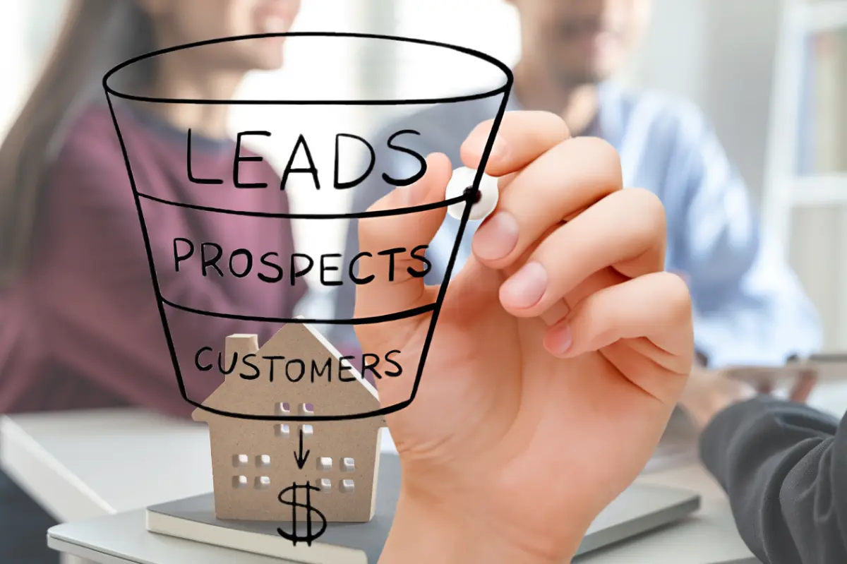 Real estate agent reviewing inbound leads on a laptop